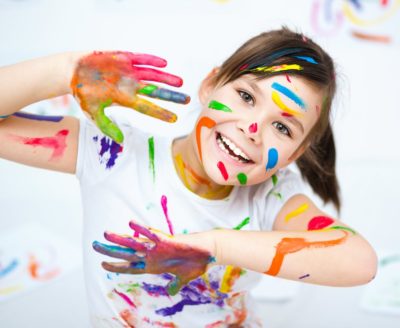 Girl with messy painted hands