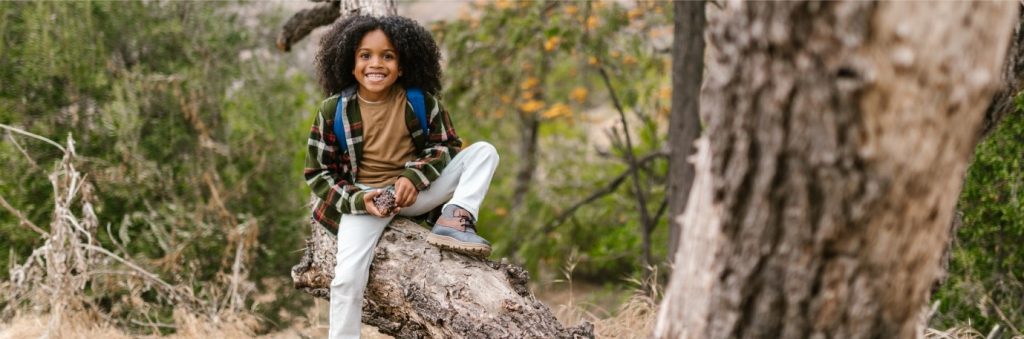 Young girl climbing tree