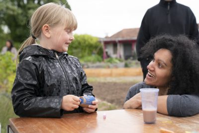 a playworker listens to a child talking